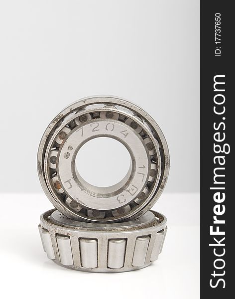 Two bearings on a gradient gray background