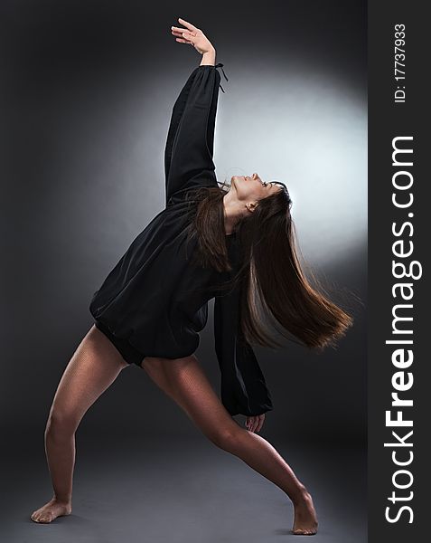 Cool dancer woman on gray background