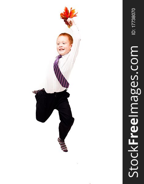 Boy with autumn leaves on a white background. Boy with autumn leaves on a white background