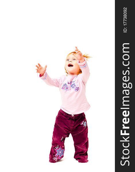 Little girl  with her hands up on a white background