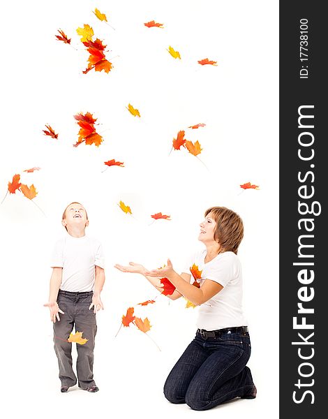 Mother with a son with autumn leaves on a white background