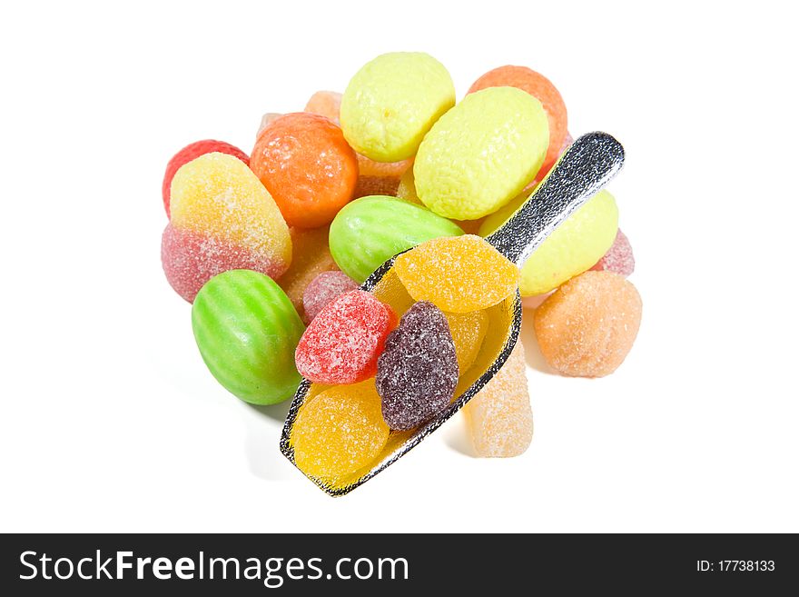 Multi-colored sweets and chewing gums on white backgrounds