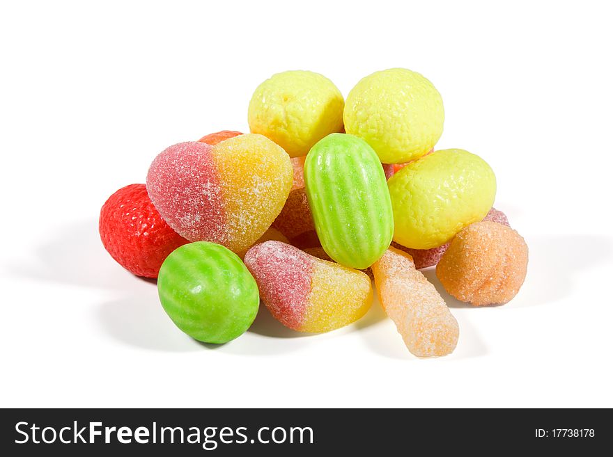 Multi-colored sweets and chewing gums on  white background