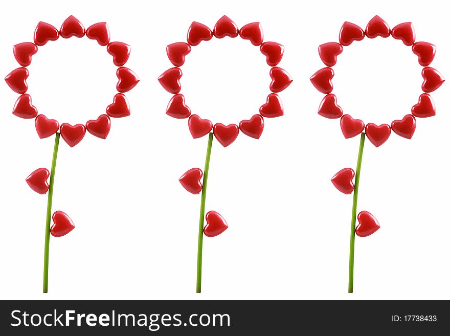 Three flowers from red symbolical hearts are isolated on a white background. Three flowers from red symbolical hearts are isolated on a white background