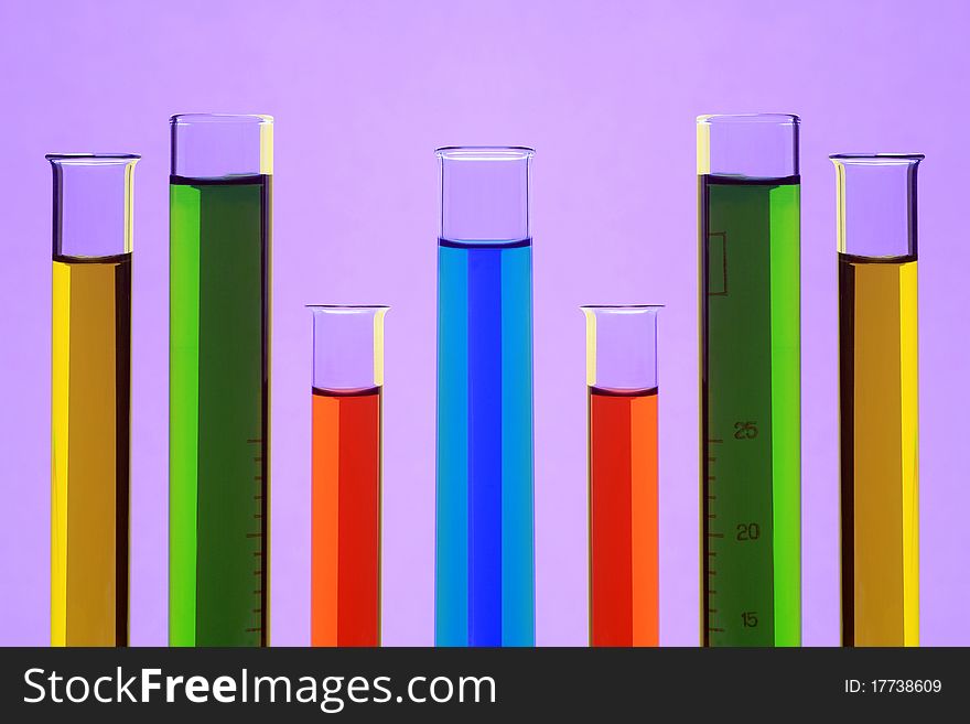 Laboratory test tubes on a violet background