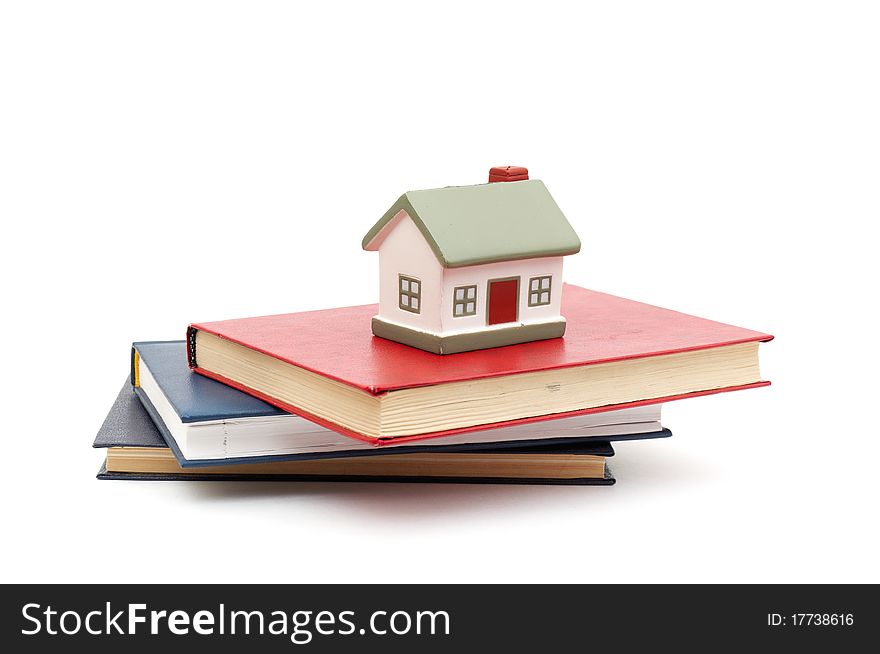 Little house and books isolated on white background