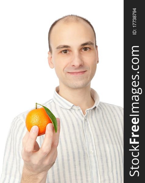 Young man holding tangerine. Isolated on white.