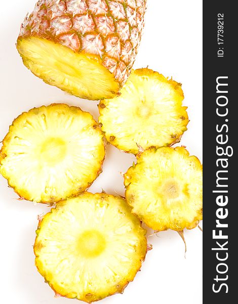 Cut pineapple isolated on white background