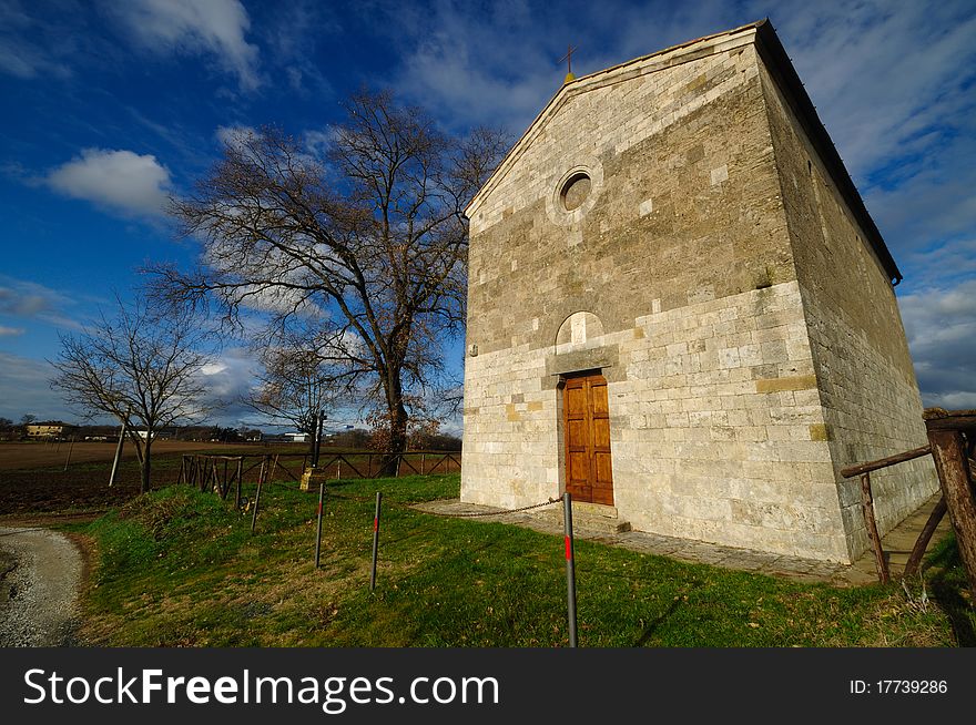 A pretty romanesque church in the country of Tuscany. A pretty romanesque church in the country of Tuscany