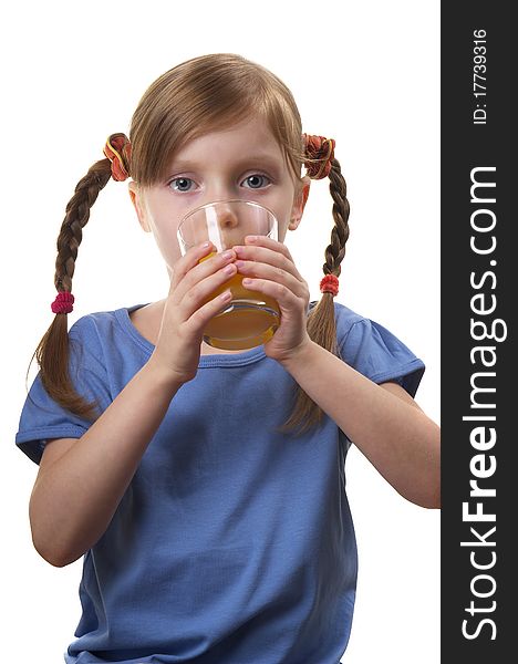 Young funny girl with a glass of juice over white background