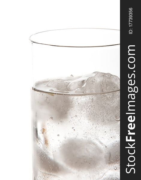 Isolated glass of soda with ice cold water