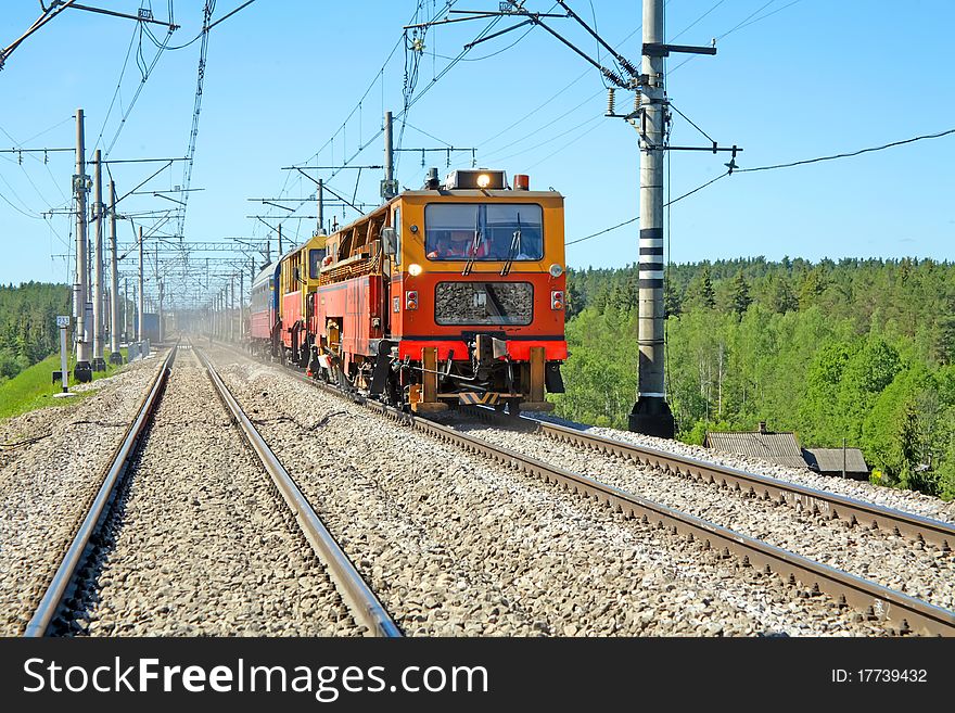 Red-orange Trolley Does Run On Railway Tracks