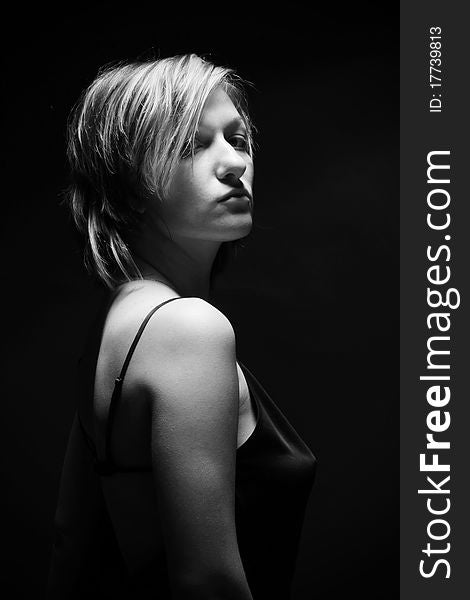 Desaturated portraite of woman with shot in studio. Desaturated portraite of woman with shot in studio