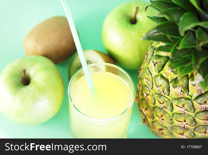 Juice and fruit on light background