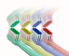Four Colored Toothbrushes Royalty Free Stock Images