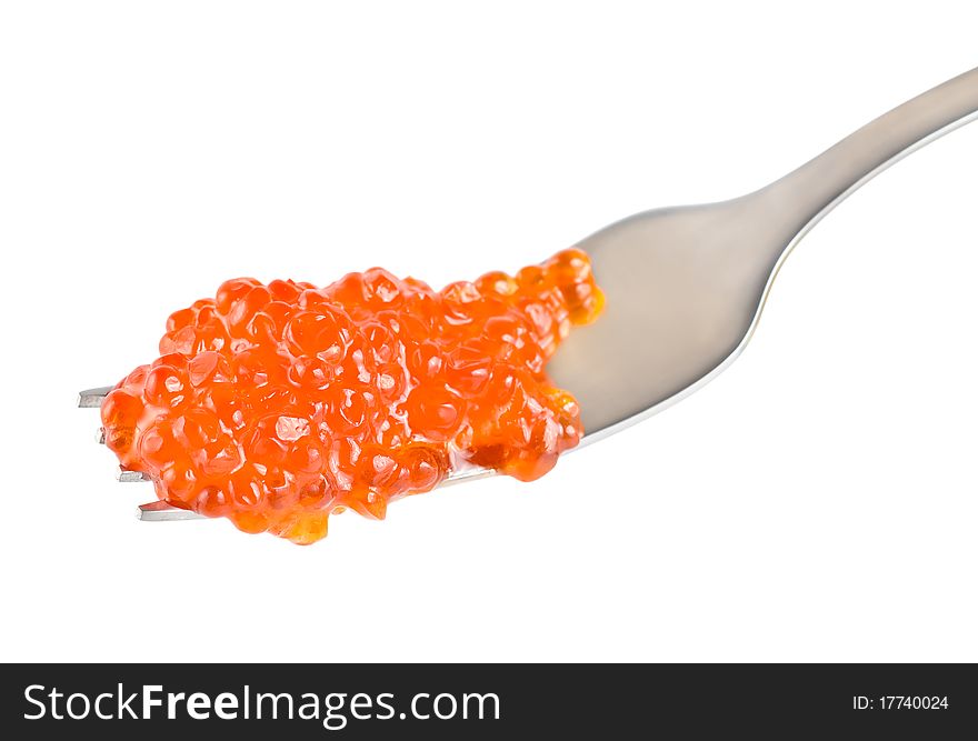 Red caviar on a fork isolated on white background