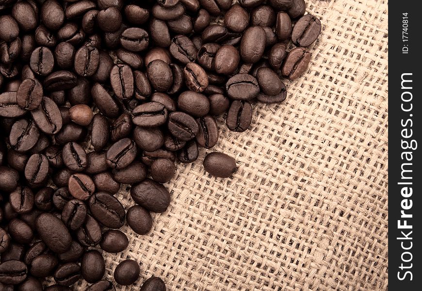 Coffee beans on brown canvas