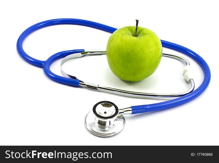 Stethoscope and green apple isolated on white background. Stethoscope and green apple isolated on white background