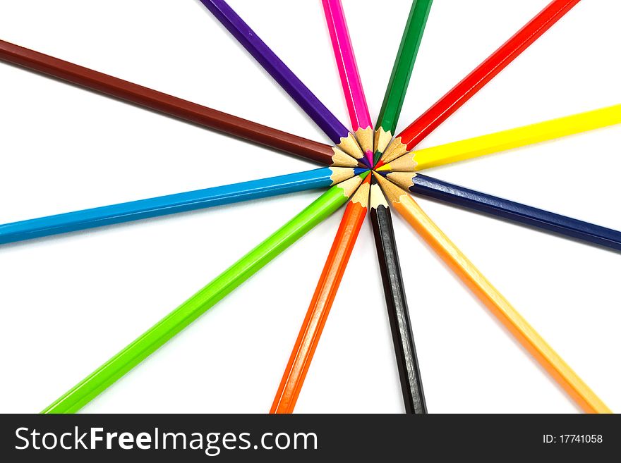 Assortment of coloured pencils on white background. Assortment of coloured pencils on white background