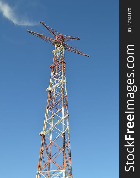 Electricity pylon on blue sky, located in Calabria,Italy.