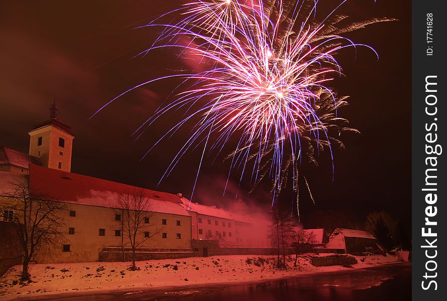 Fireworks near castle, in Strakonice, Czech Republic, New Year celebration