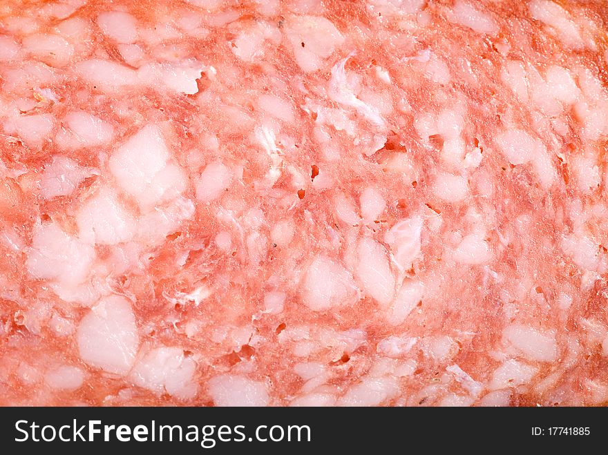 Background of smoked sausage salami with fat. Background of smoked sausage salami with fat