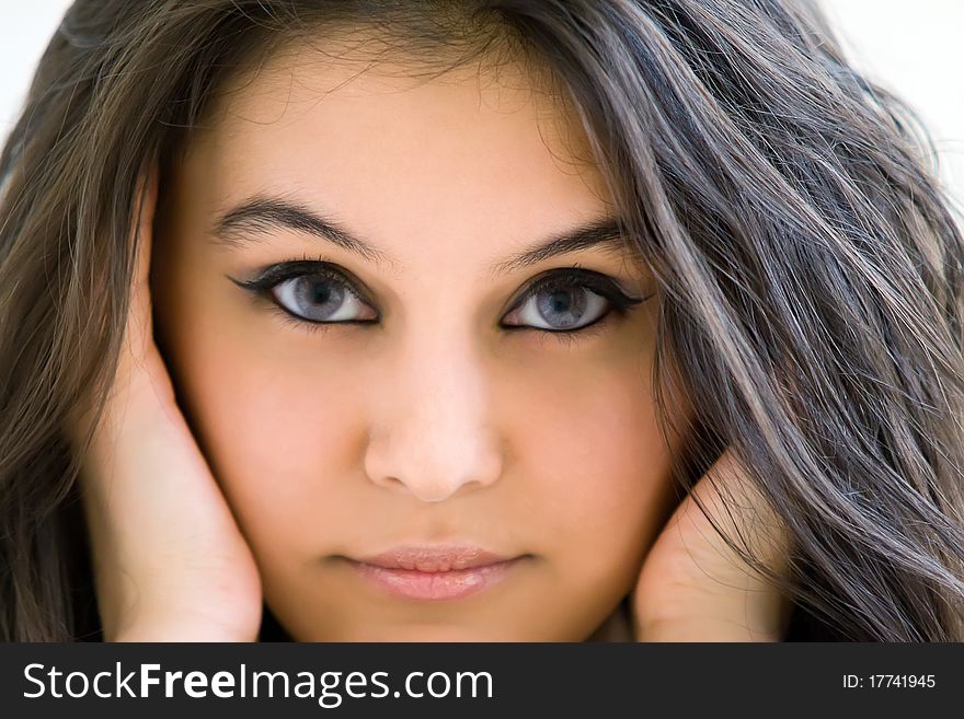 Beautiful Asian girl, photographed in close-up look at the camera. Beautiful look. Hair