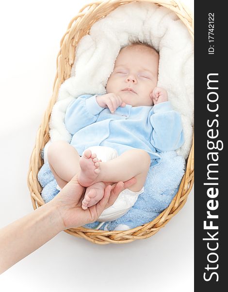 Newborn baby feet in mother hand