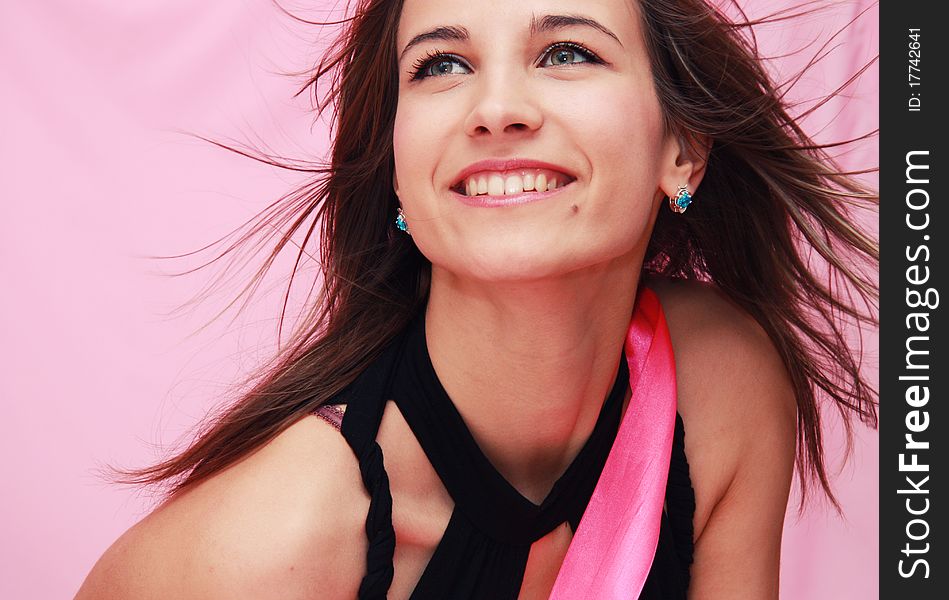 Beautiful Young Smiling Girl On A Pink Background