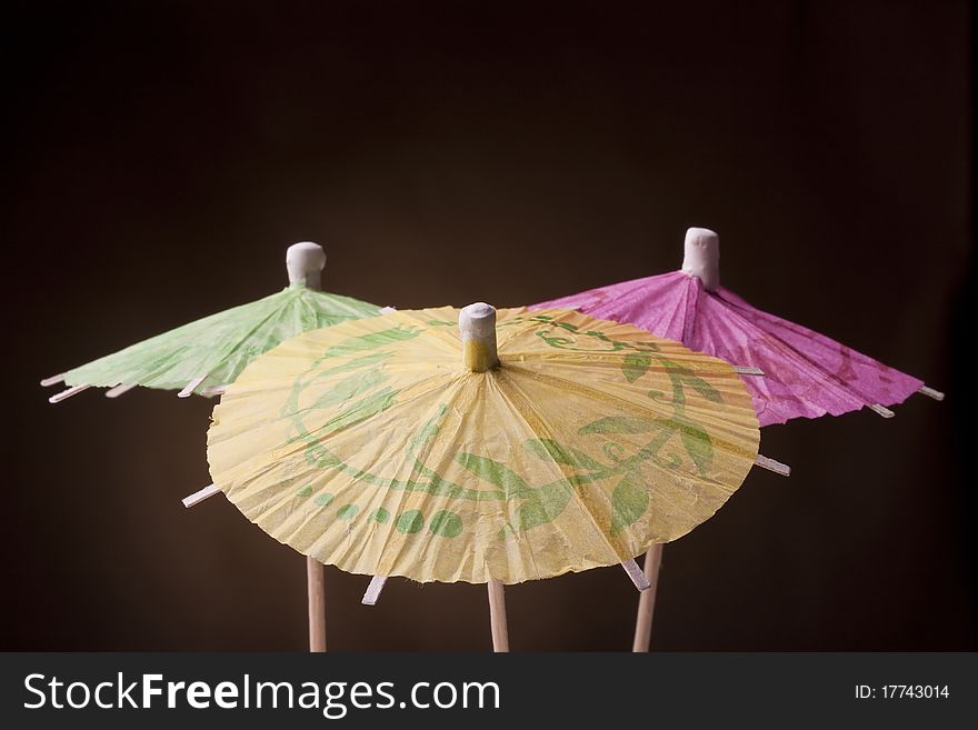 Paper umbrellas to decorate the glasses with a cocktail.