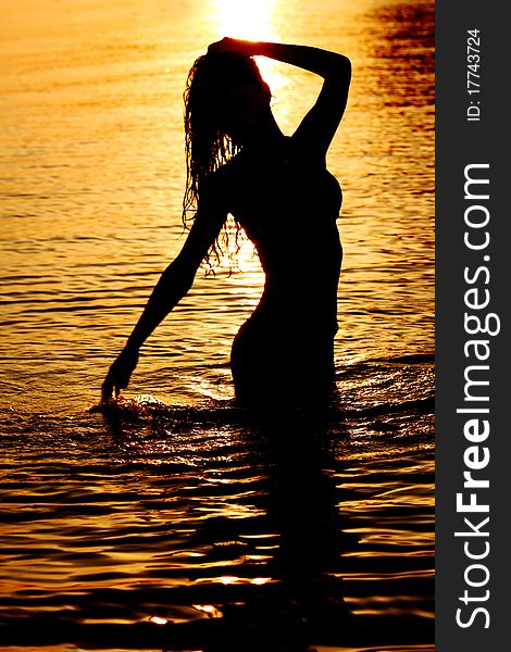 Ocean woman in sunrise light. Ocean woman in sunrise light