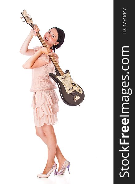 A beautiful smiling woman is holding the electro guitar. isolated on a white background. A beautiful smiling woman is holding the electro guitar. isolated on a white background