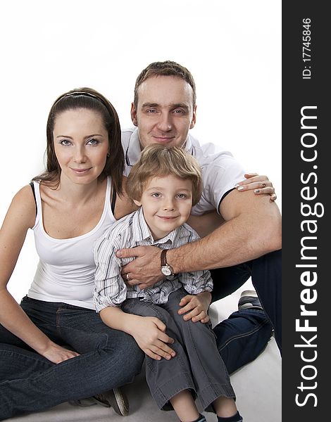 Young European family from three persons - mother, father and son. Young European family from three persons - mother, father and son.