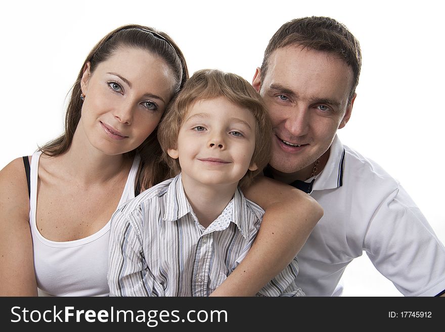 Young European family from three persons - mother, father and son. Young European family from three persons - mother, father and son.