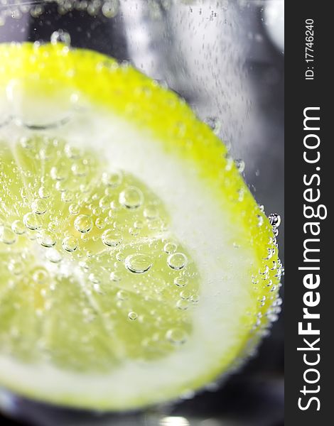 Lemon and drops of carbonated water