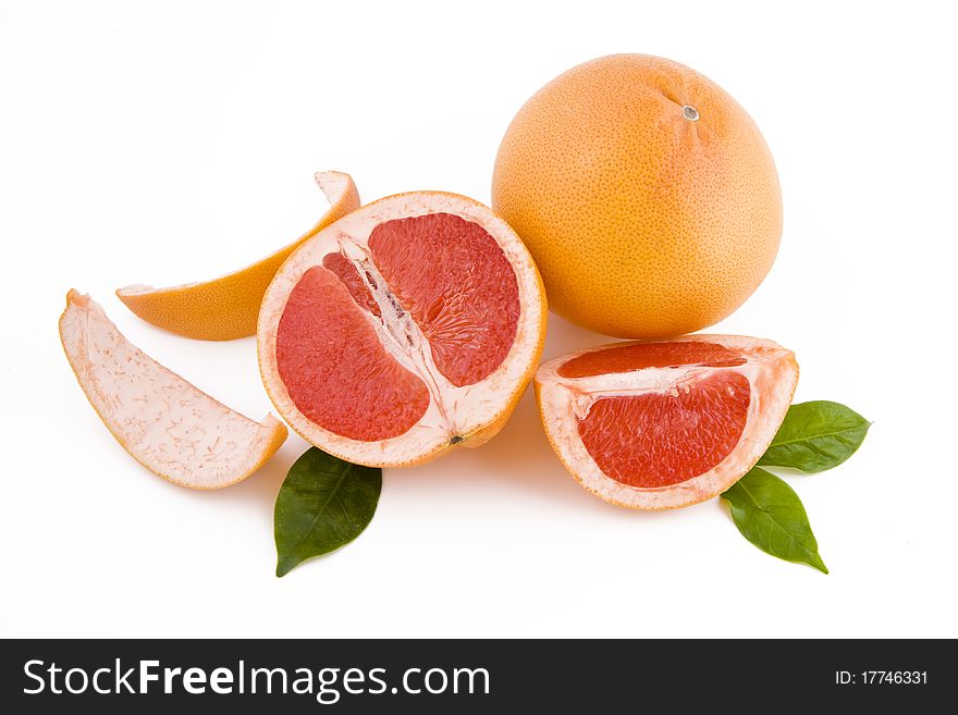 Fresh peeled red grapefruits isolated on white background. Fresh peeled red grapefruits isolated on white background