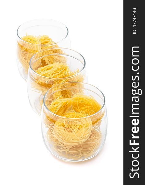 Pasta in glass jar on a white background