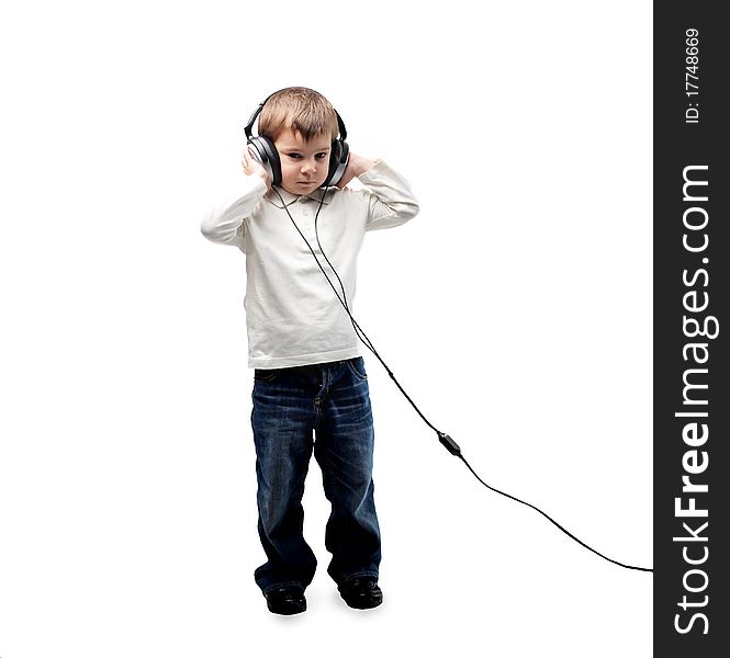 Child listening to music through headphones. Child listening to music through headphones