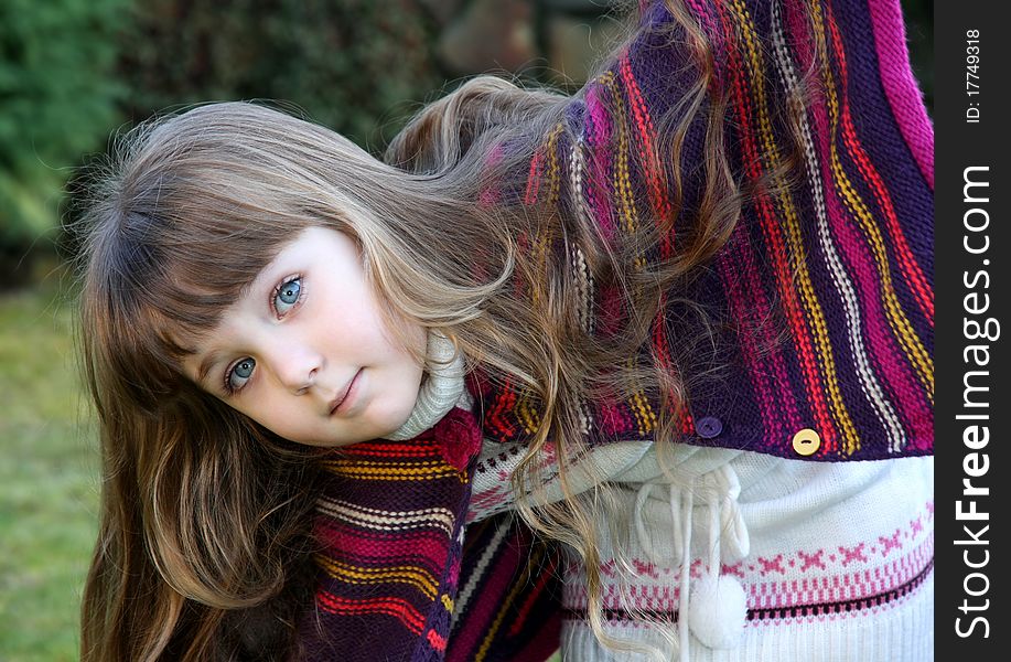 Beautiful little portrait of girl in park