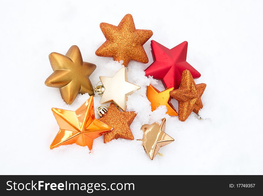 Beautiful set of Christmas decorations star shaped over snow. Beautiful set of Christmas decorations star shaped over snow.