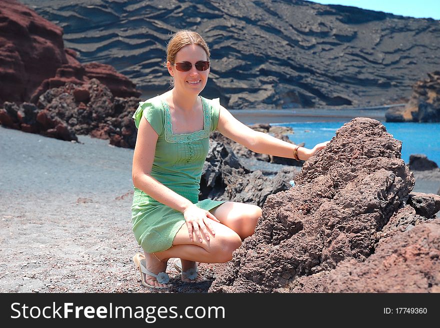 Young woman at the desert of Lanzarote at the canary islands from Spain. Young woman at the desert of Lanzarote at the canary islands from Spain