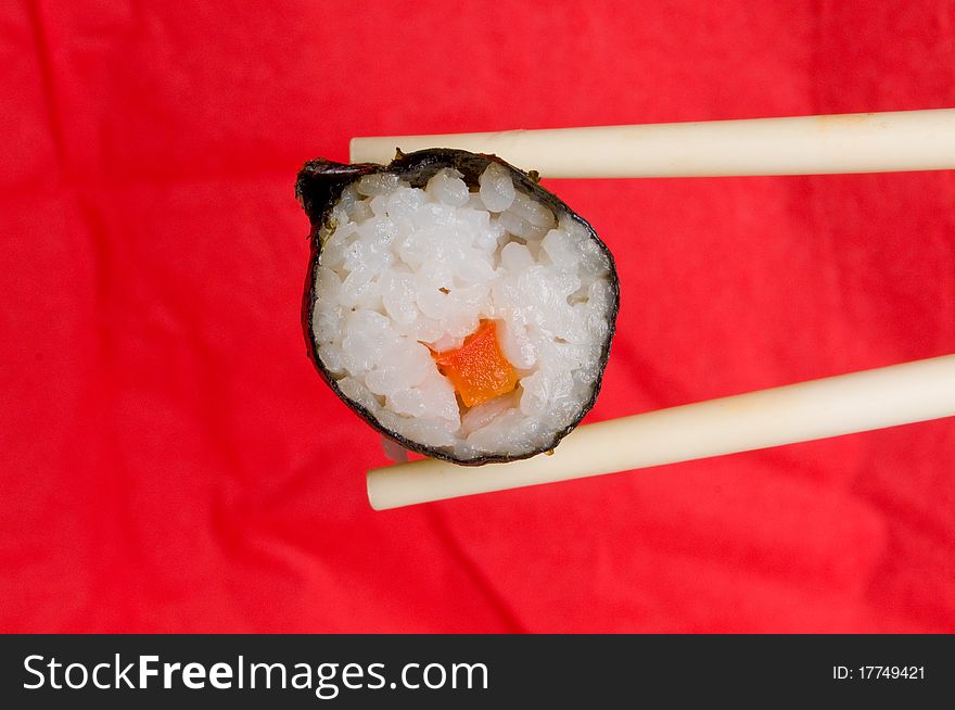 Japanese Sushi chopsticks red background