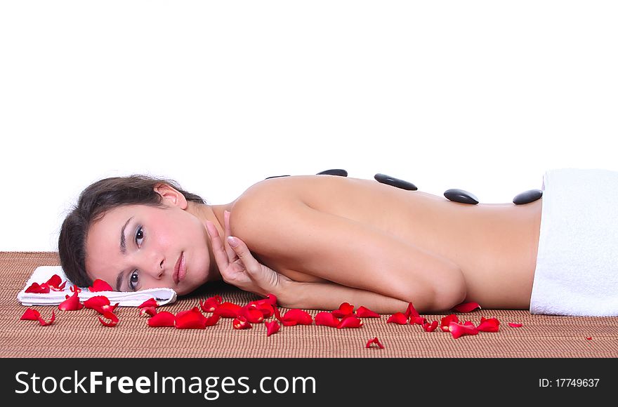 Beautiful woman lying on a brown mat