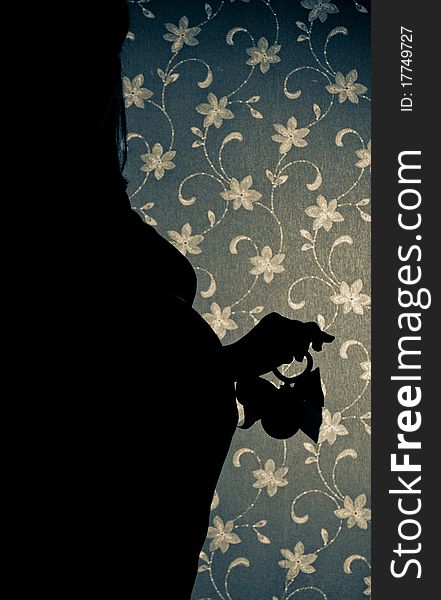 A silhouette of a pregnant woman at  studio. A silhouette of a pregnant woman at  studio