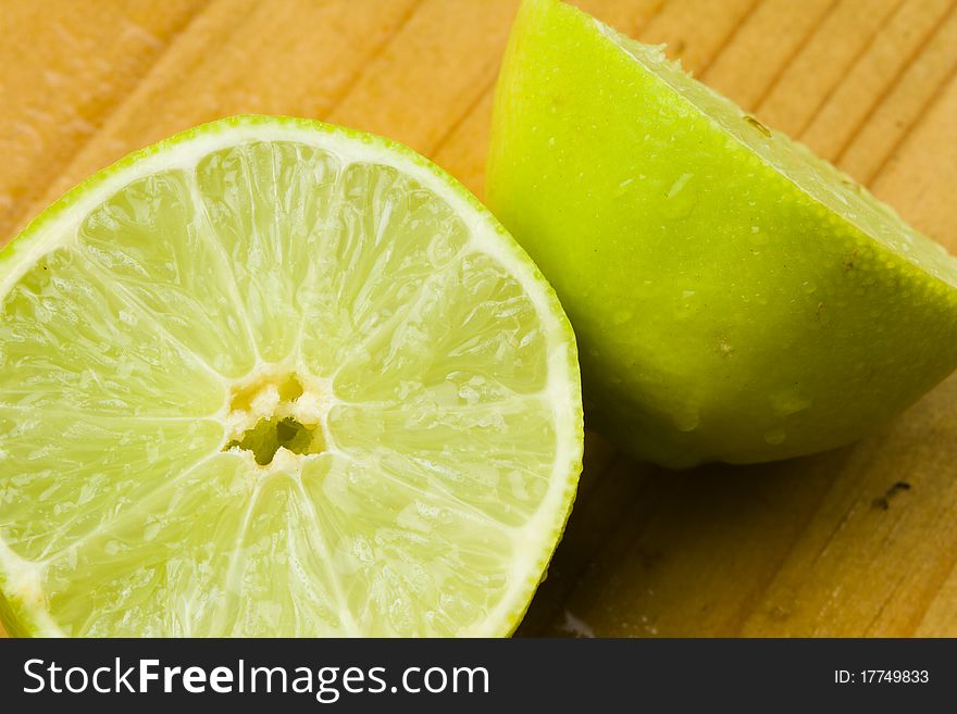 Green organic sweet lime fruit cut in two halves