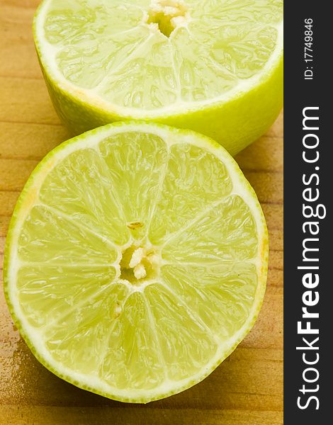 Green organic sweet lime fruit cut in two halves. Green organic sweet lime fruit cut in two halves