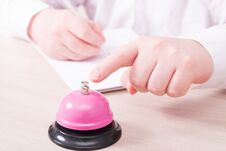 A Man In A White Shirt Presses A Finger On A Pink Service Bell And Signs A Contract Stock Photo