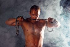 Young Sporty Man Over Smoke. Royalty Free Stock Photography Young Sporty Man Over Smoke. Royalty Free Stock Photography
