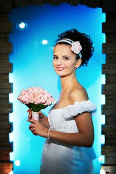 Beautiful Bride With Flowers On Blue Background Stock Image