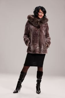Young Woman In A Fur Coat Royalty Free Stock Photo